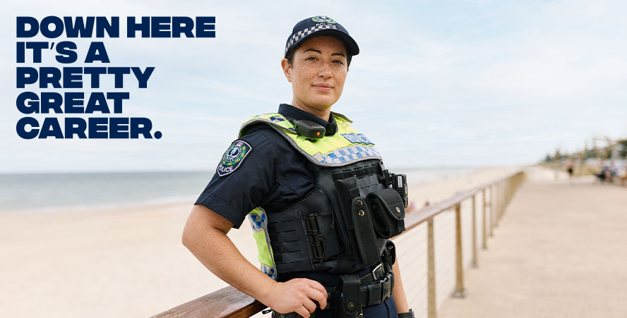 Down here its a pretty great career with a smiling female polcie officer on the beach
