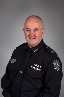 upper torso shot Peter Harvey Assistant Commissioner Crime Service