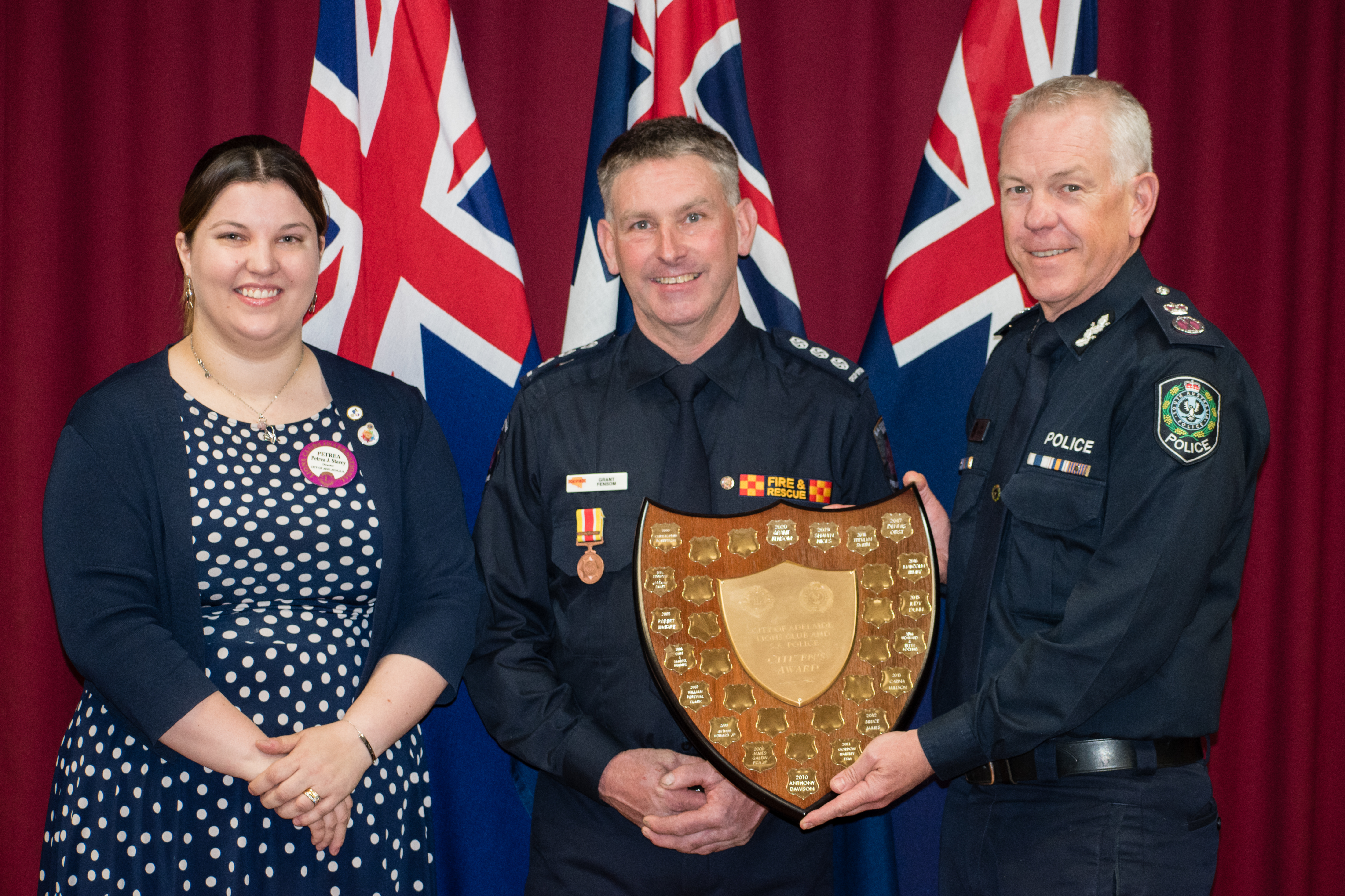 President of The Lions Club of the City of Adelaide, Petrea Stacey, award recipient Grant Fensom and Police Commissioner Grant Stevens.